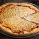 cheese pizza on wooden table